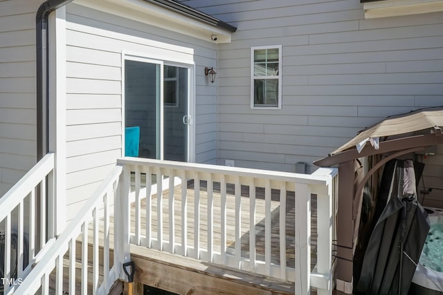 76 Freewill Pl, Raleigh, NC 27603 - view of home's exterior with a wooden deck and a surveillance system