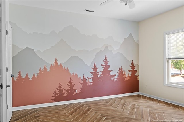 empty room with baseboards and ceiling fan