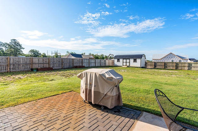 view of patio featuring a shed and an outdoor structure