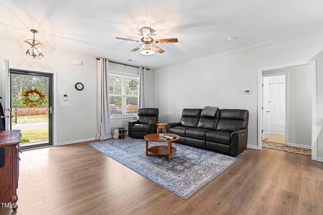 173 Longbow Dr, Middlesex, NC 27557 - living area featuring wood finished floors, a ceiling fan, baseboards, and a chandelier