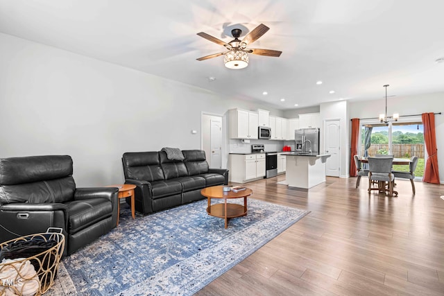 173 Longbow Dr, Middlesex, NC 27557 - living area with a ceiling fan, a chandelier, wood finished floors, and recessed lighting