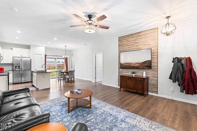 173 Longbow Dr, Middlesex, NC 27557 - living area featuring a chandelier, a ceiling fan, wood finished floors, baseboards, and recessed lighting