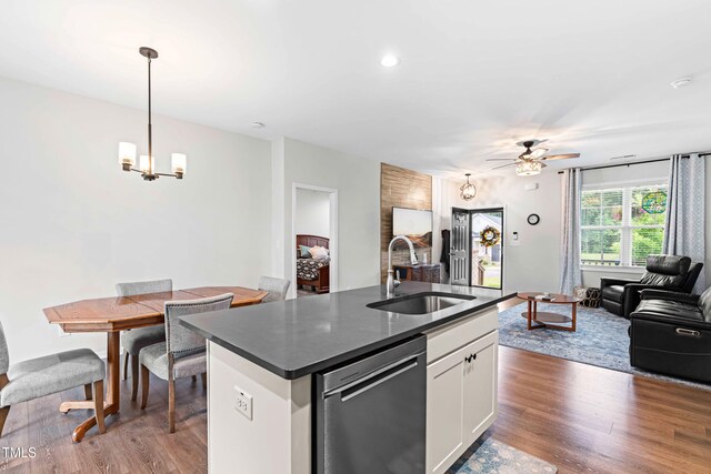 173 Longbow Dr, Middlesex, NC 27557 - kitchen featuring a sink, dishwasher, dark countertops, open floor plan, and a ceiling fan