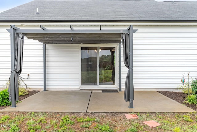 173 Longbow Dr, Middlesex, NC 27557 - rear view of house with a shingled roof and a patio