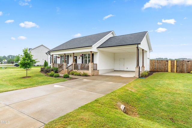 173 Longbow Dr, Middlesex, NC 27557 - view of front of house featuring covered porch, roof with shingles, an attached carport, and driveway