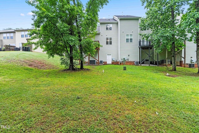 112 River Dell Townes Ave, Clayton, NC 27527 - back of house featuring central AC and a lawn