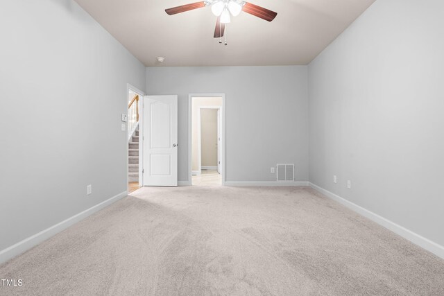 112 River Dell Townes Ave, Clayton, NC 27527 - unfurnished bedroom featuring light carpet, baseboards, and a ceiling fan
