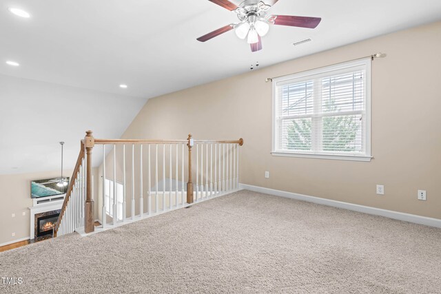 112 River Dell Townes Ave, Clayton, NC 27527 - carpeted empty room featuring ceiling fan, baseboards, recessed lighting, a premium fireplace, and lofted ceiling