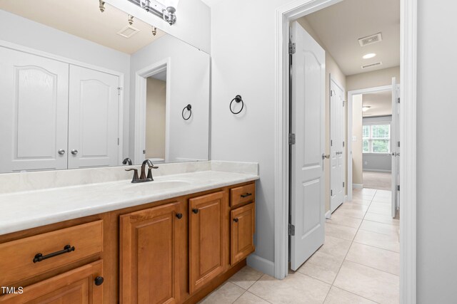 112 River Dell Townes Ave, Clayton, NC 27527 - bathroom with tile patterned floors, vanity, and baseboards