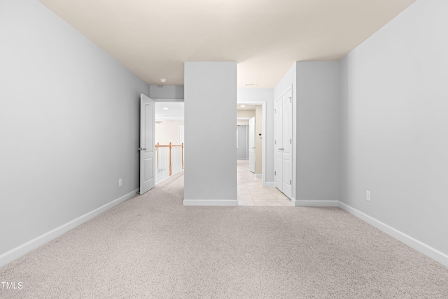 112 River Dell Townes Ave, Clayton, NC 27527 - unfurnished bedroom with light carpet, baseboards, and a closet