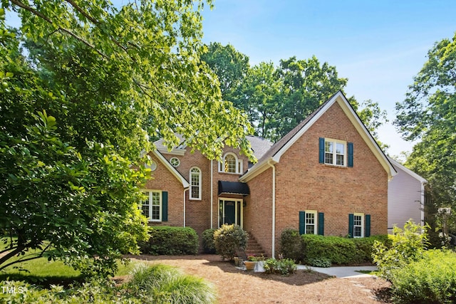 traditional home with brick siding