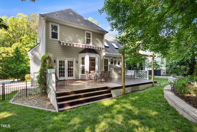 back of house with french doors, a wooden deck, and a shingled roof