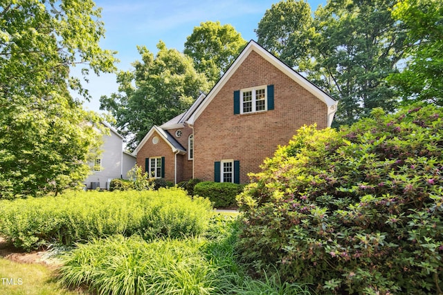 view of front of home featuring brick siding