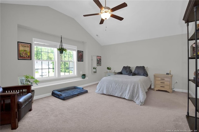 carpeted bedroom with lofted ceiling, baseboards, and ceiling fan