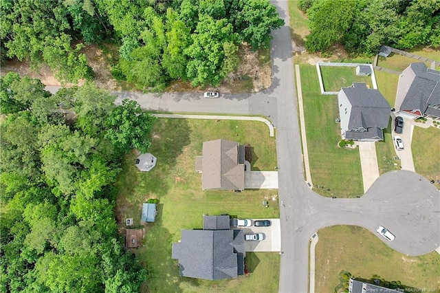 aerial view of property and surrounding area with nearby suburban area