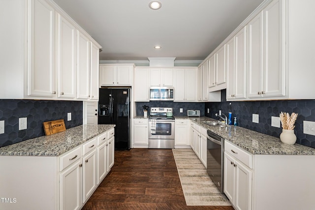187 Ashley Woods Ct, Clayton, NC 27527 - kitchen with appliances with stainless steel finishes, white cabinets, backsplash, and recessed lighting