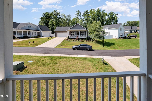 187 Ashley Woods Ct, Clayton, NC 27527 - view of grassy yard featuring concrete driveway, a residential view, and an attached garage