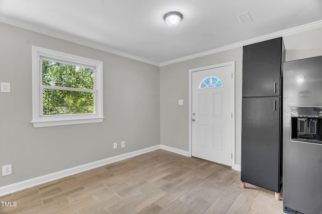 308 Lynn Rd, Durham, NC 27703 - entryway featuring crown molding, baseboards, and light wood finished floors