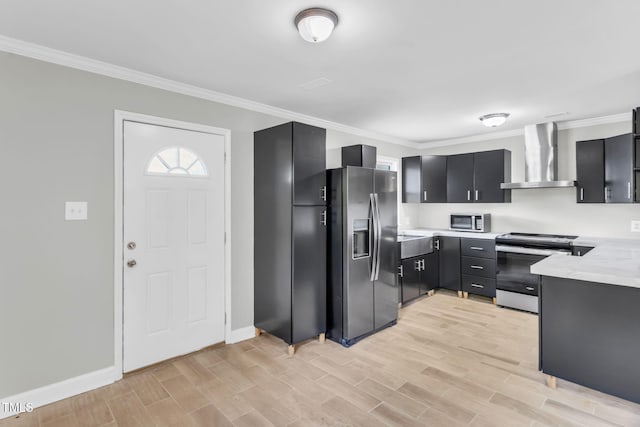 308 Lynn Rd, Durham, NC 27703 - kitchen with appliances with stainless steel finishes, wall chimney range hood, ornamental molding, dark cabinetry, and light wood-style flooring