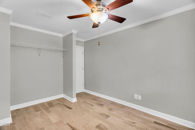 308 Lynn Rd, Durham, NC 27703 - unfurnished bedroom featuring ornamental molding, baseboards, light wood finished floors, a ceiling fan, and a closet