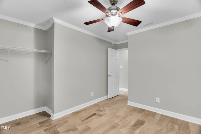 308 Lynn Rd, Durham, NC 27703 - unfurnished bedroom featuring light wood finished floors, baseboards, crown molding, and ceiling fan