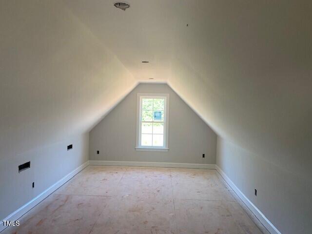 bonus room featuring vaulted ceiling