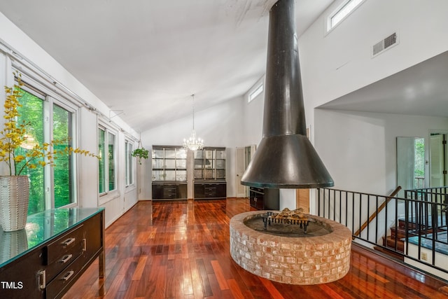 3416 Ocotea St, Raleigh, NC 27607 - hall featuring wood-type flooring, a chandelier, plenty of natural light, and high vaulted ceiling