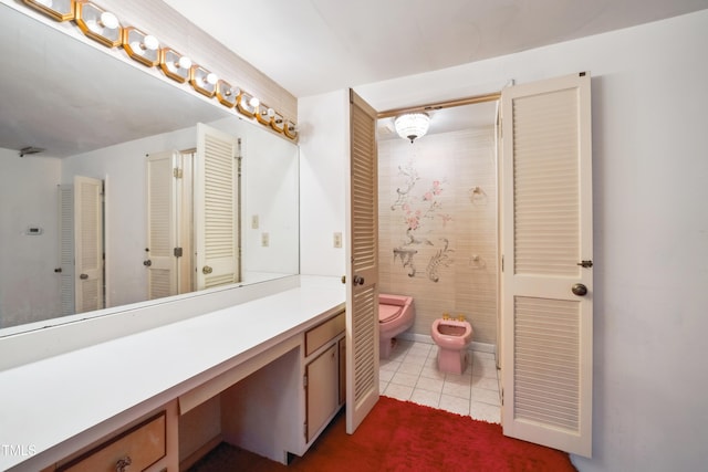 3416 Ocotea St, Raleigh, NC 27607 - bathroom featuring a bidet, vanity, toilet, and tile patterned flooring