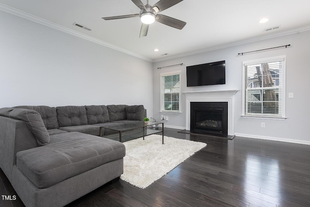living area with baseboards, healthy amount of natural light, a ceiling fan, recessed lighting, and dark wood-style flooring
