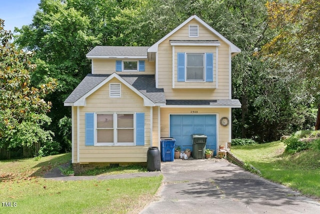view of front facade with roof with shingles, asphalt driveway, a front lawn, a garage, and crawl space