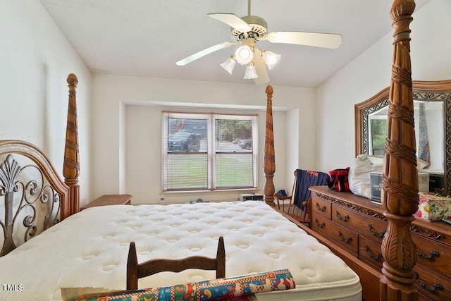 bedroom with multiple windows and ceiling fan