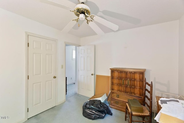 bedroom with ceiling fan and light colored carpet