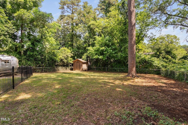 view of yard with a shed and an outbuilding