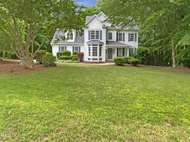 150 Remington Ct, Youngsville, NC 27596 - view of front facade with a shingled roof and a front yard
