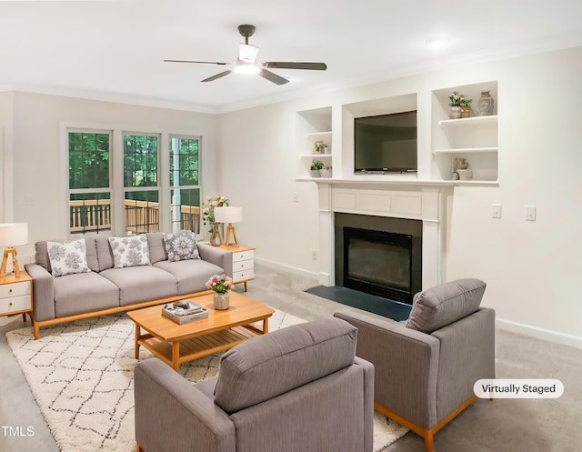 150 Remington Ct, Youngsville, NC 27596 - living room with baseboards, ceiling fan, ornamental molding, built in shelves, and a fireplace with flush hearth