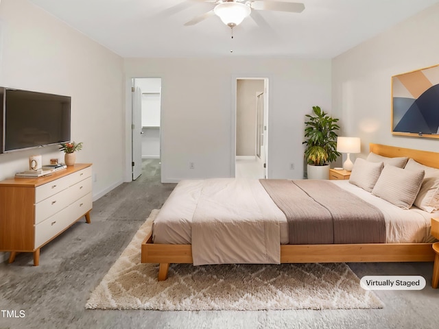 150 Remington Ct, Youngsville, NC 27596 - carpeted bedroom featuring a ceiling fan and a walk in closet