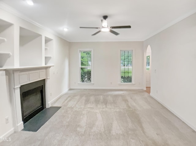150 Remington Ct, Youngsville, NC 27596 - unfurnished living room with ceiling fan, a fireplace with flush hearth, baseboards, and crown molding