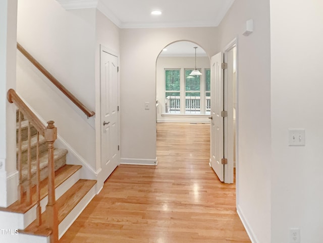 150 Remington Ct, Youngsville, NC 27596 - hall with light wood-style floors, ornamental molding, baseboards, arched walkways, and recessed lighting