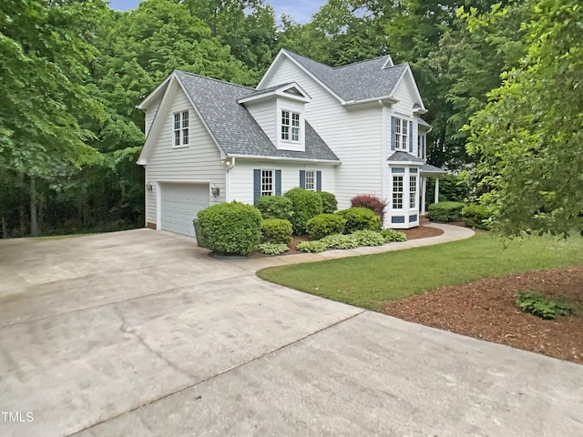 150 Remington Ct, Youngsville, NC 27596 - view of front of property featuring roof with shingles, concrete driveway, an attached garage, and a front yard