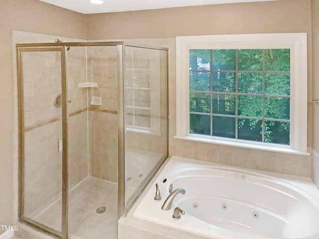 150 Remington Ct, Youngsville, NC 27596 - bathroom featuring a stall shower, a whirlpool tub, and healthy amount of natural light