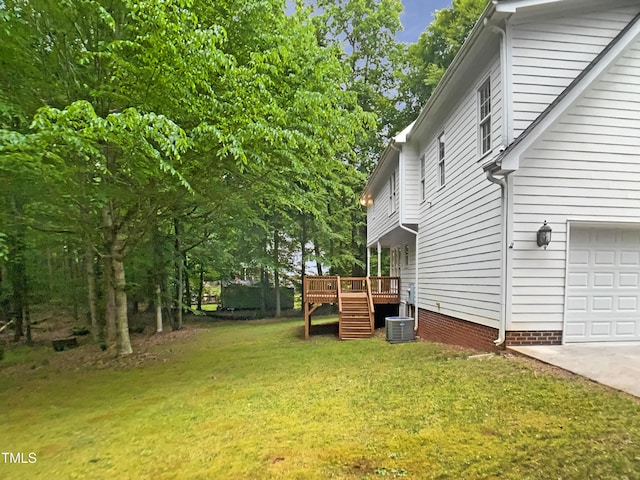 150 Remington Ct, Youngsville, NC 27596 - view of grassy yard featuring a deck, an attached garage, stairs, and central AC unit