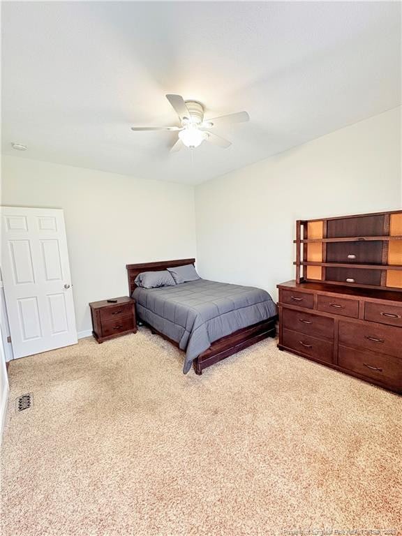 bedroom with carpet floors, baseboards, and a ceiling fan
