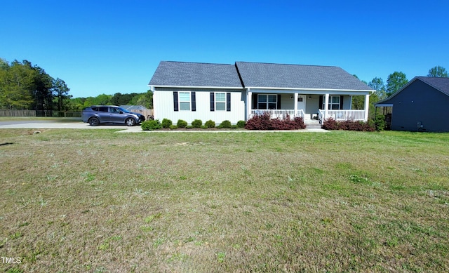 212 Placid Pond Dr, Broadway, NC 27505 - view of front of house featuring covered porch and a front yard