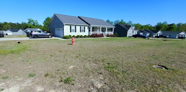 212 Placid Pond Dr, Broadway, NC 27505 - ranch-style house with covered porch, an attached garage, a front lawn, and concrete driveway