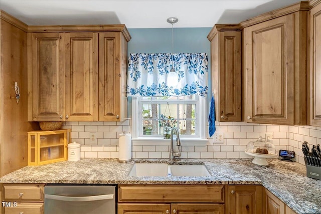 kitchen with a sink, stainless steel dishwasher, backsplash, and light stone countertops