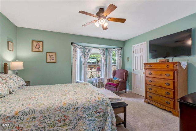 bedroom with carpet flooring, a ceiling fan, and baseboards