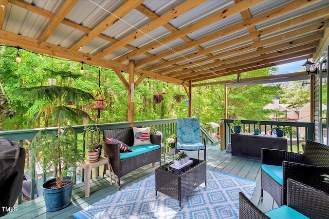 wooden terrace with an outdoor hangout area