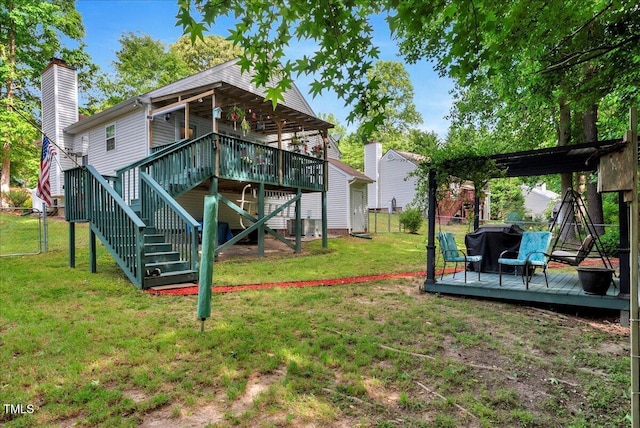 back of house with a wooden deck, a chimney, and stairway