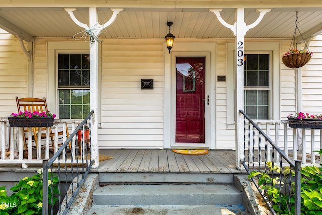 doorway to property featuring a porch