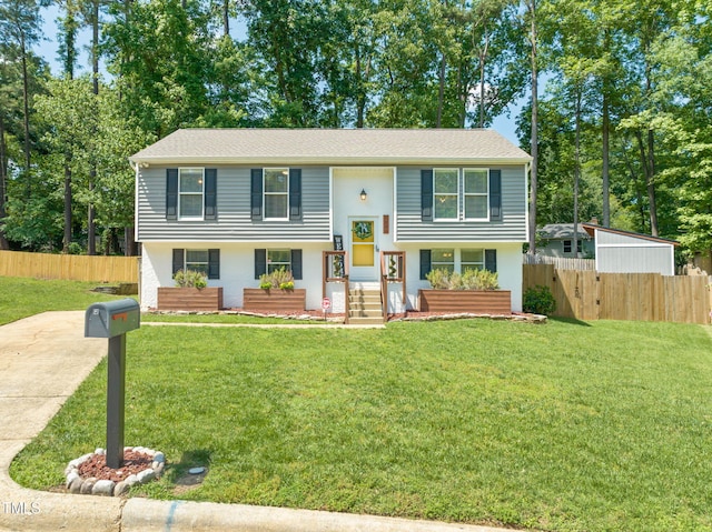 split foyer home featuring stucco siding and driveway